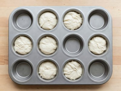Twelve-cup muffin pan with only six alternating checkerboard cavities filled with batter